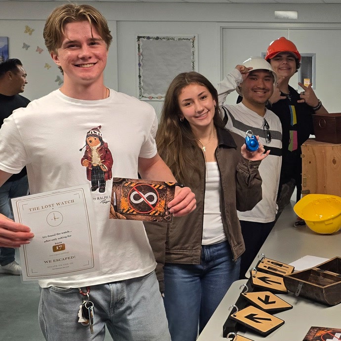 Teens playing an escape room in a church multipurpose room